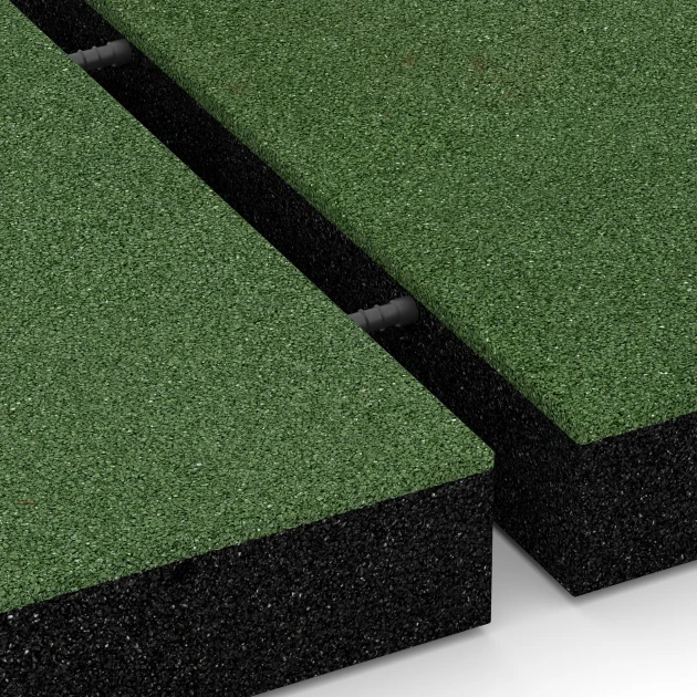 Großaufnahme vom Verbindungssystem von WARCO-Boden 6207 - Fallschutzplatten im Farbdesign Grasgrün. Abmessungen 50 x 50 x 8 cm.