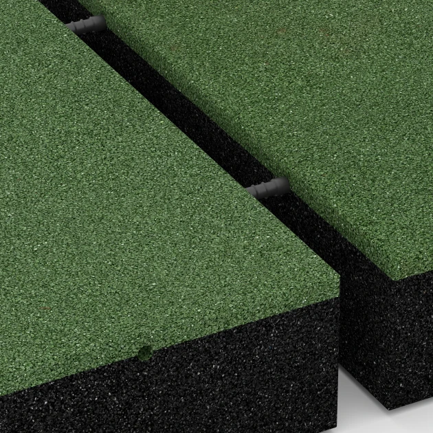 Großaufnahme vom Verbindungssystem von WARCO-Boden 6211 - Fallschutzplatten im Farbdesign Grasgrün. Abmessungen 50 x 50 x 11 cm.